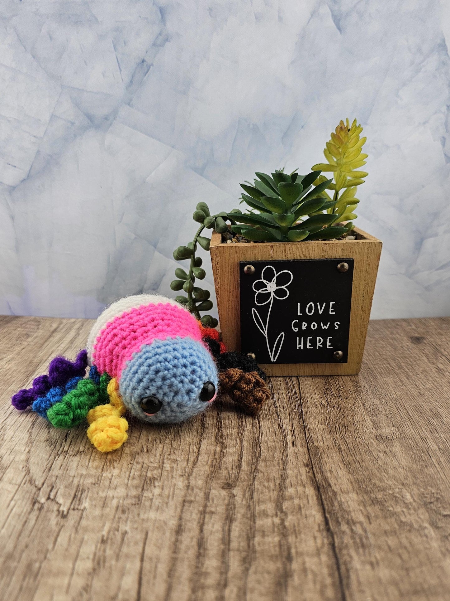 Handcrafted crocheted pride flag Spider buddy named Justice