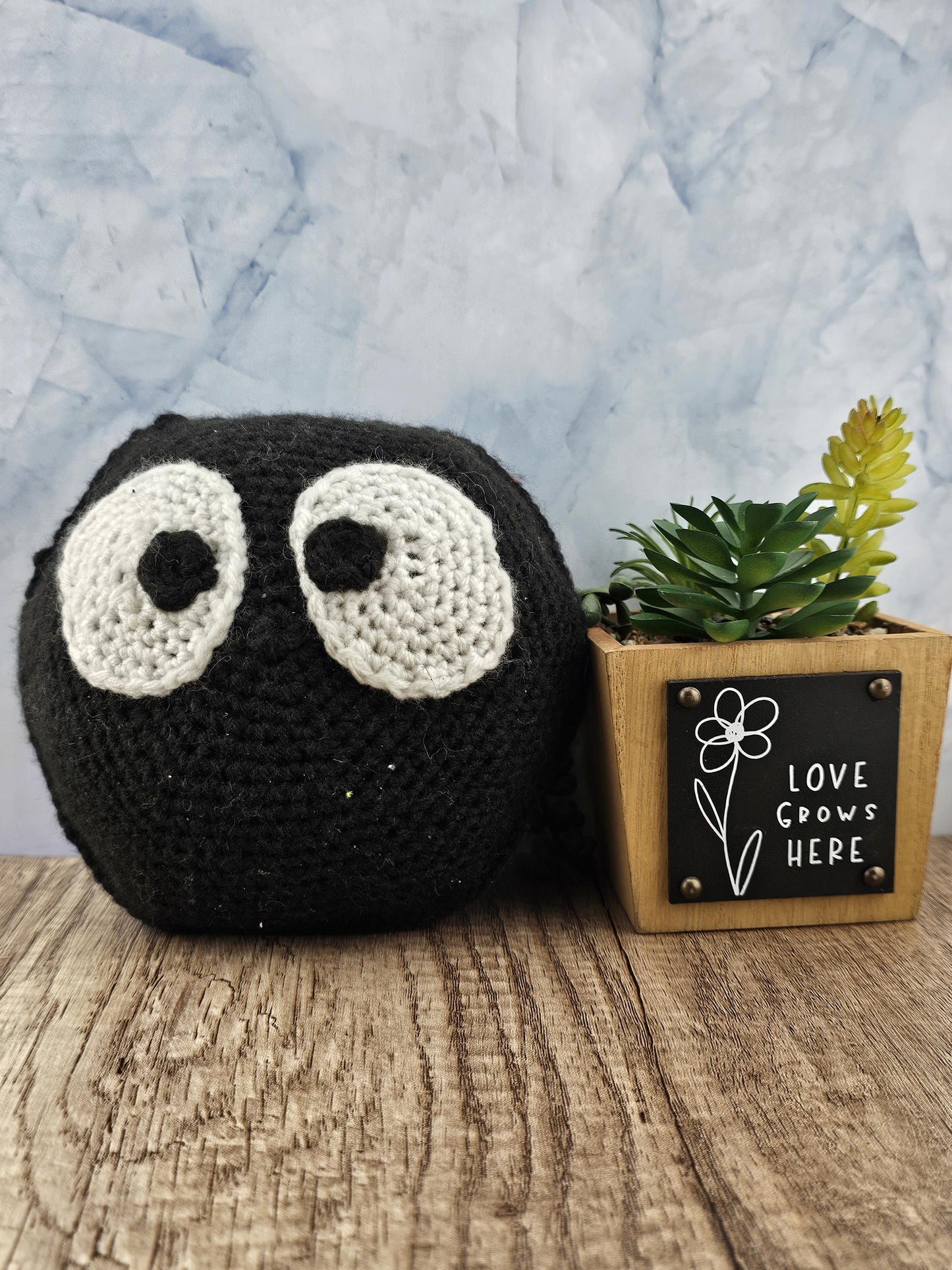 Handcrafted crocheted soot sprite inspired buddy named Soot