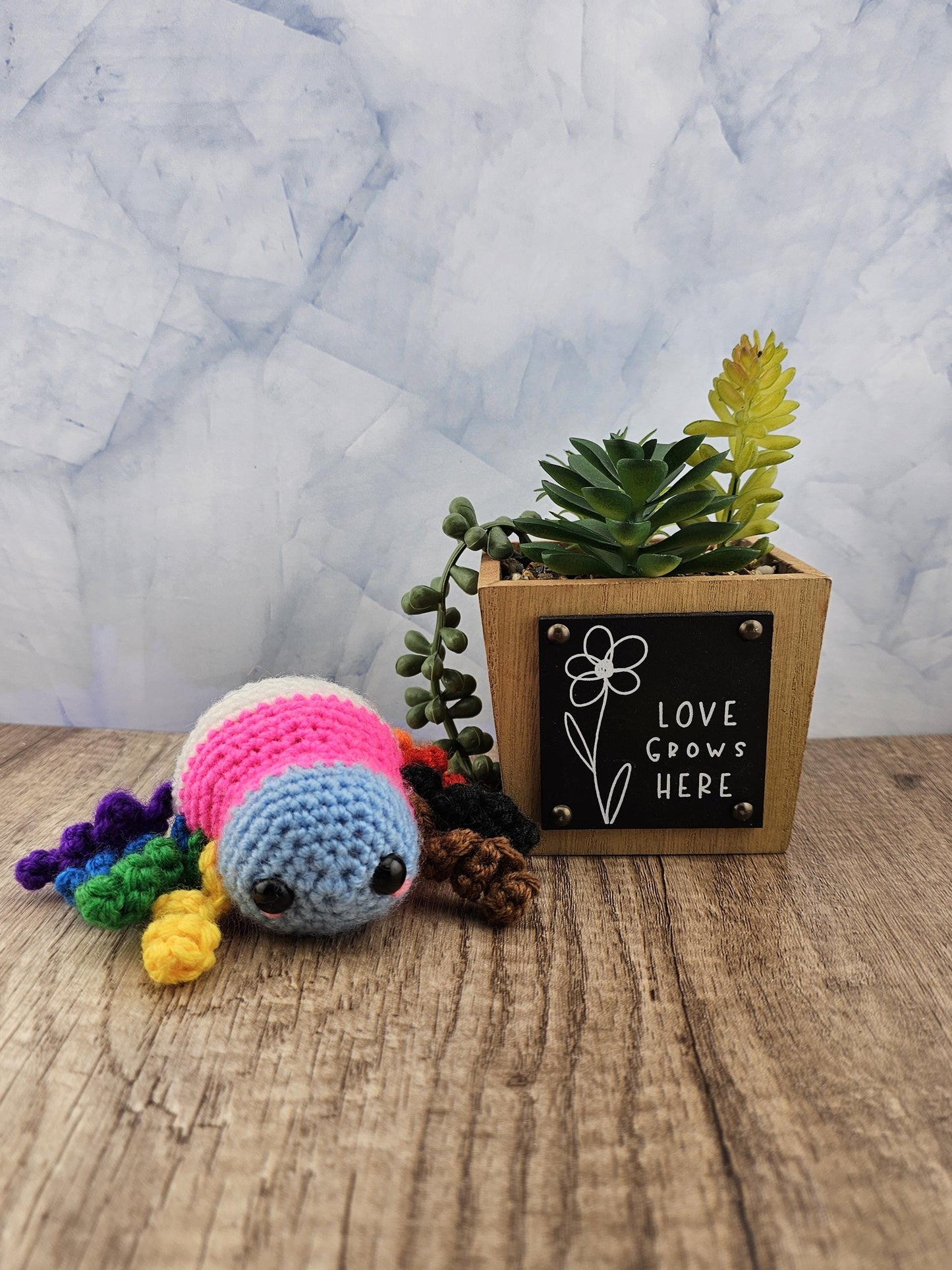 Handcrafted crocheted pride flag Spider buddy named Justice