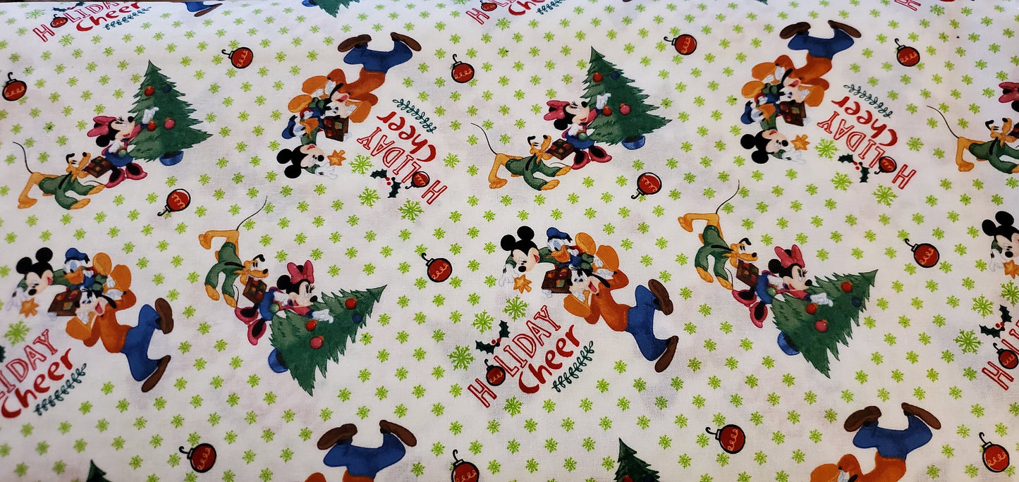 Mickey & Friends Trim the Christmas Tree Disney Fabric by the half yard. 100% Cotton.