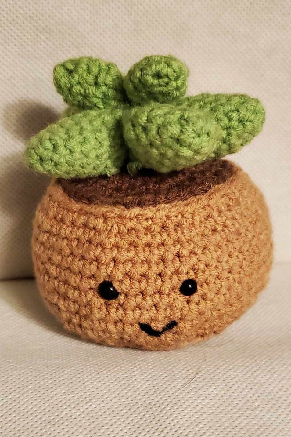 Handcrafted crochet succulent in a brown crochet pot.