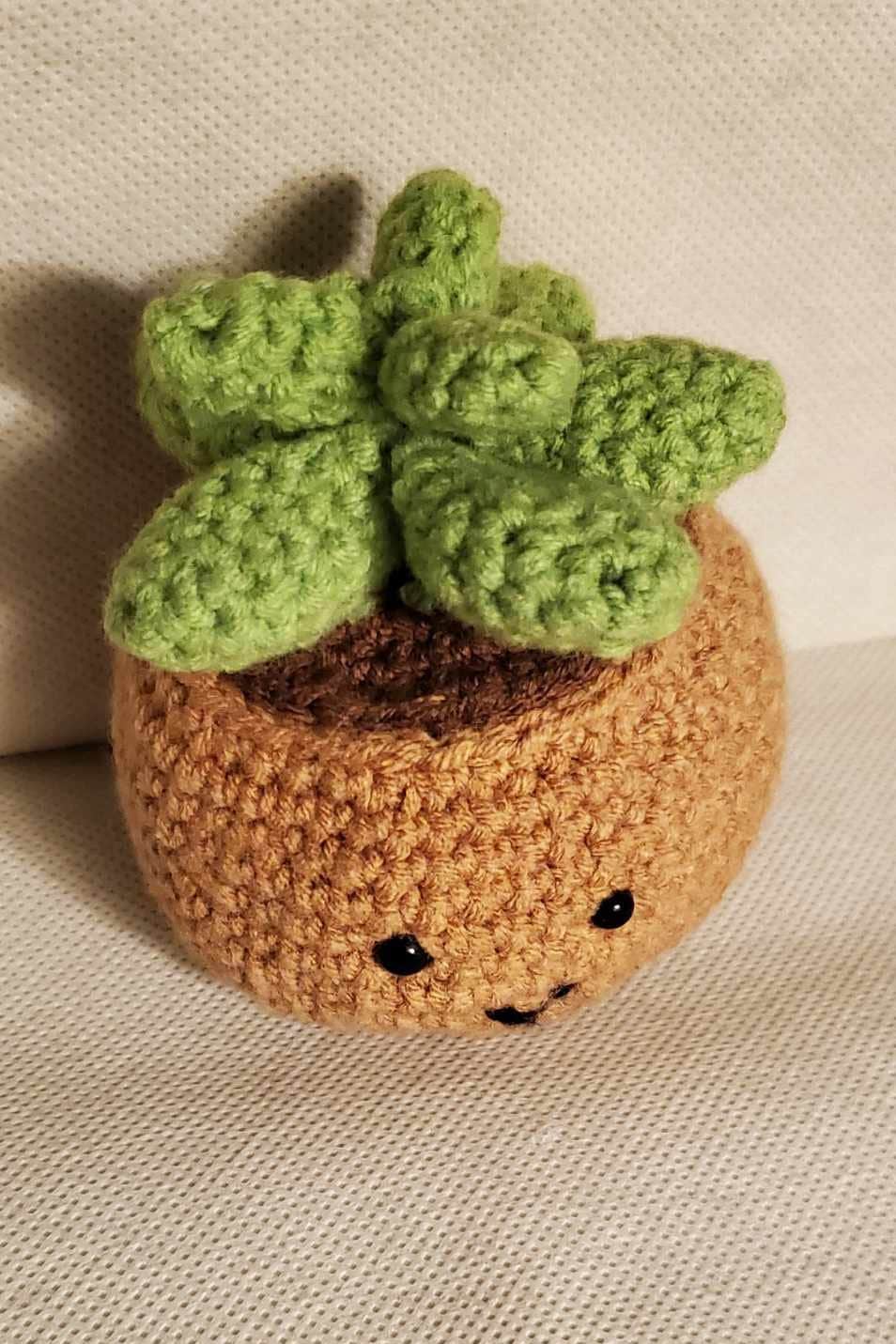 Handcrafted crochet succulent in a brown crochet pot.