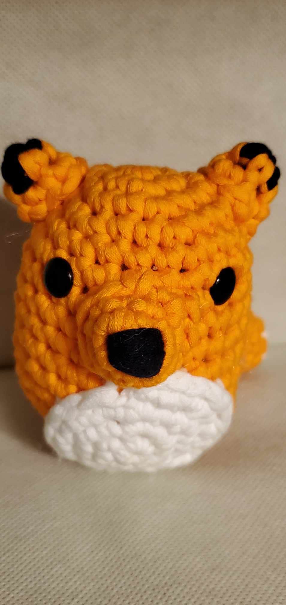 Handcrafted crocheted fox buddy named Copper. Orange and White with black tipped ears.