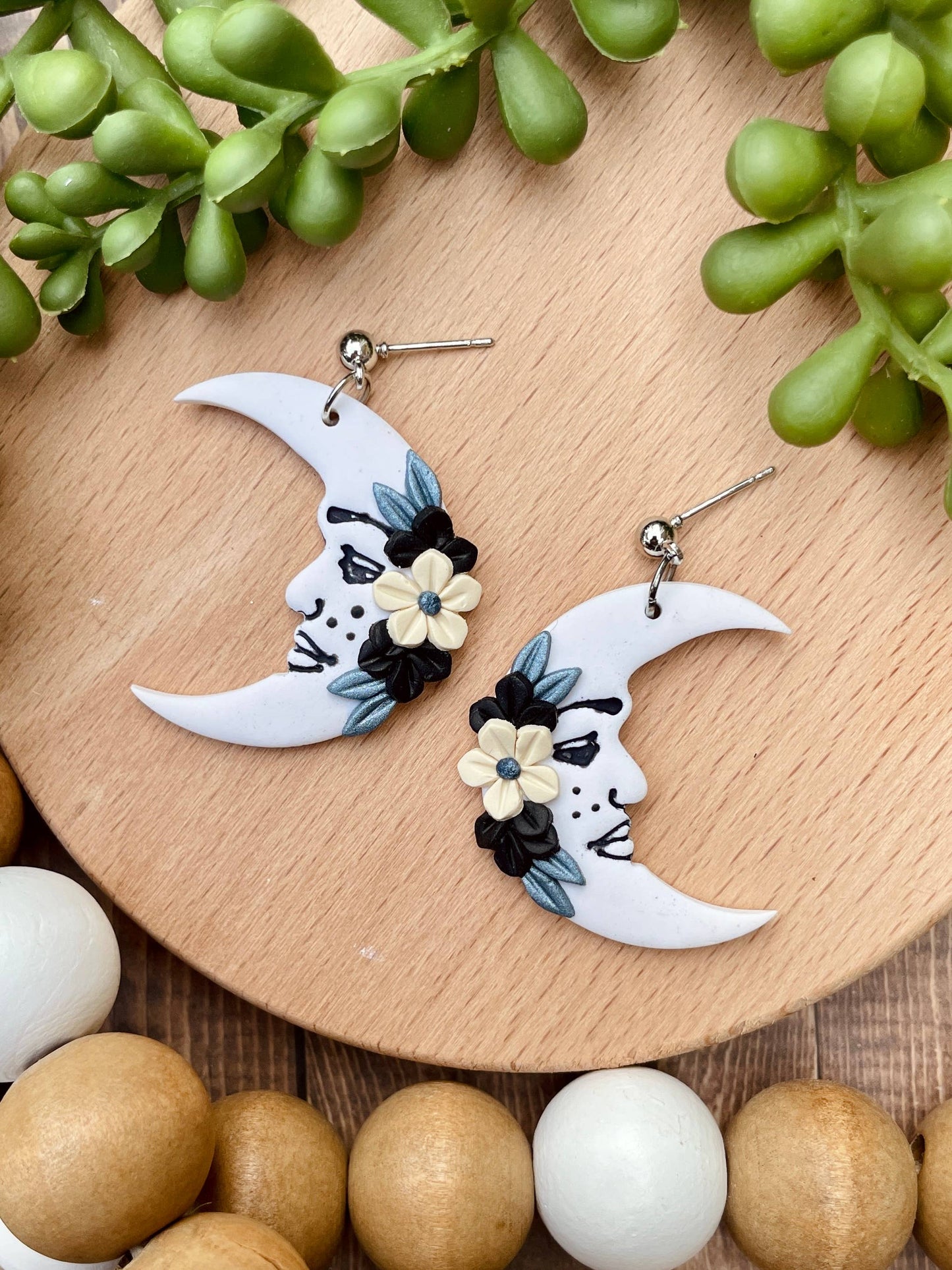 Floral freckled moon clay dangle earrings