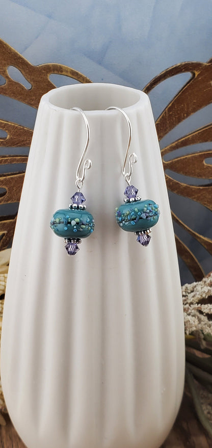 Lavender Bliss Artisan Glass Earrings, Lampwork Glass Bead handcrafted by a talented artisan, Silver Filled Earring Wire. Lavender and Teal Green beads.