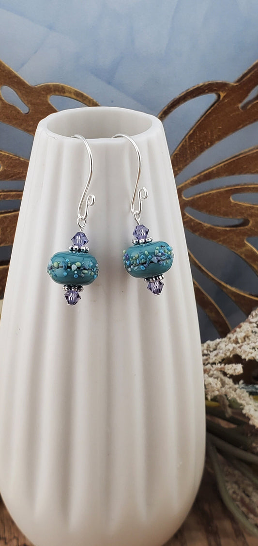 Lavender Bliss Artisan Glass Earrings, Lampwork Glass Bead handcrafted by a talented artisan, Silver Filled Earring Wire. Lavender and Teal Green beads.