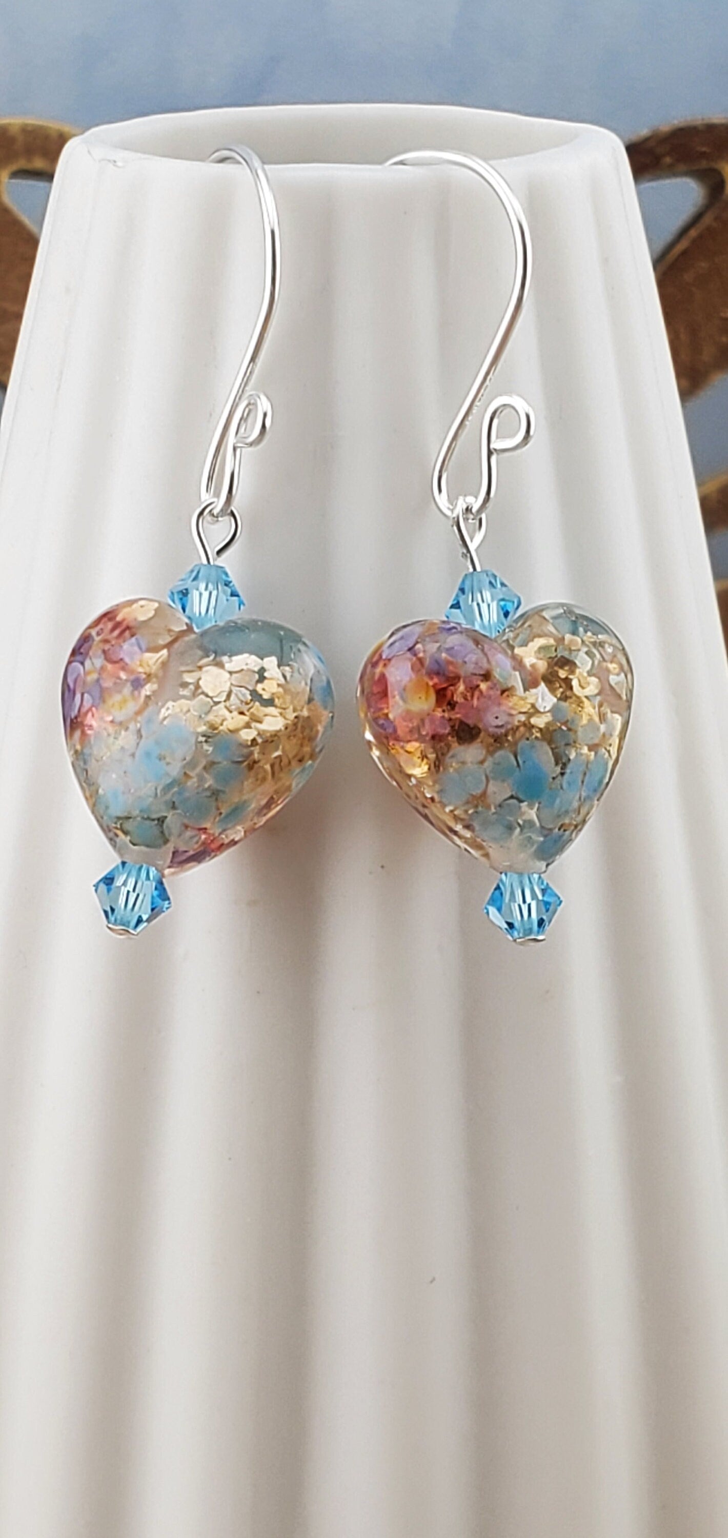 Fall in Love Artisan Glass Earrings, Lampwork Glass Bead handcrafted by a talented artisan, Silver Filled Earring Wire. Copper, blue and red swirls inside glass hearts accented with Blue crystal beads. Faill in love with autumn colors.