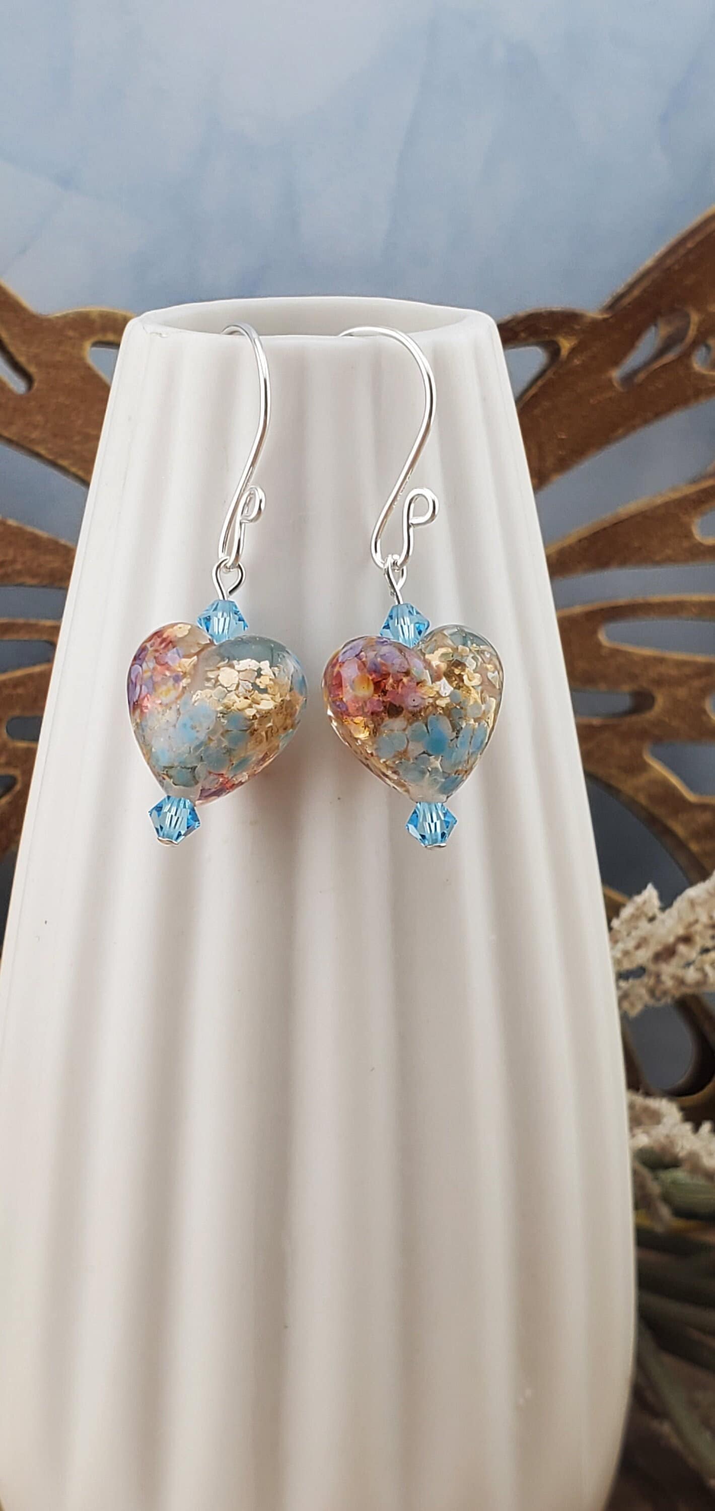 Fall in Love Artisan Glass Earrings, Lampwork Glass Bead handcrafted by a talented artisan, Silver Filled Earring Wire. Copper, blue and red swirls inside glass hearts accented with Blue crystal beads. Faill in love with autumn colors.