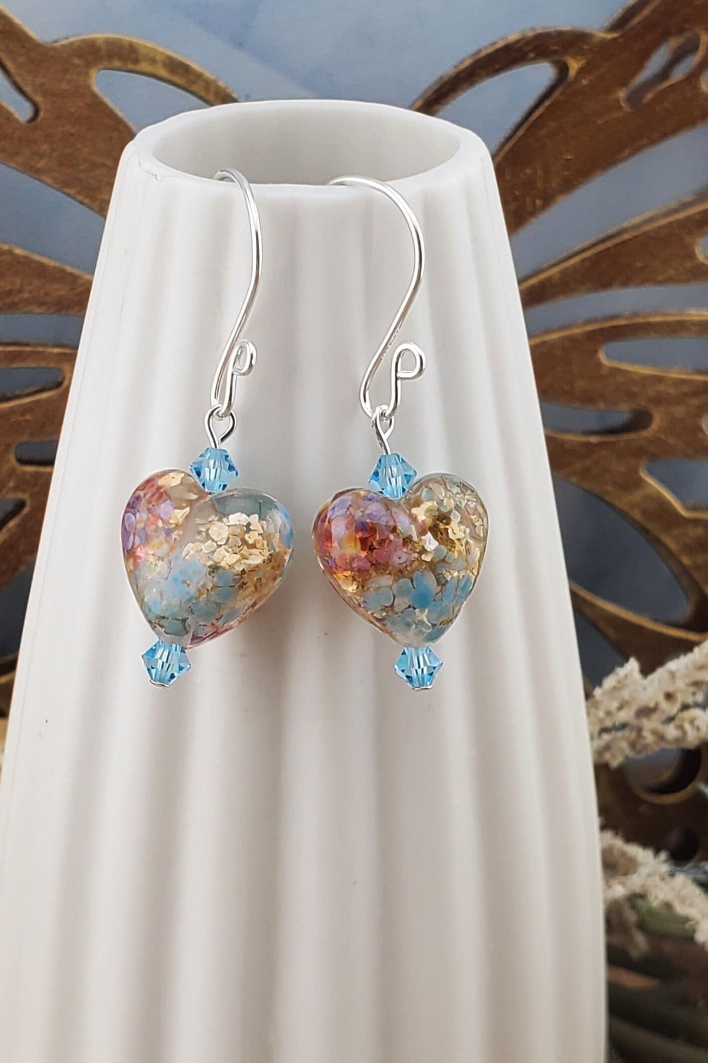 Fall in Love Artisan Glass Earrings, Lampwork Glass Bead handcrafted by a talented artisan, Silver Filled Earring Wire. Copper, blue and red swirls inside glass hearts accented with Blue crystal beads. Faill in love with autumn colors.