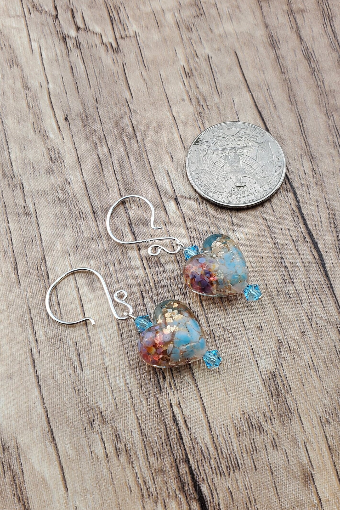 Fall in Love Artisan Glass Earrings, Lampwork Glass Bead handcrafted by a talented artisan, Silver Filled Earring Wire. Copper, blue and red swirls inside glass hearts accented with Blue crystal beads. Faill in love with autumn colors.