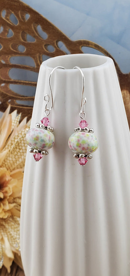 Robins egg Artisan Glass Earrings, Lampwork Glass Bead handcrafted by a talented artisan, Silver Filled Earring Wire. Lampwork beads filled with pink, green and yellow speckles complimented by pink crystal beads.