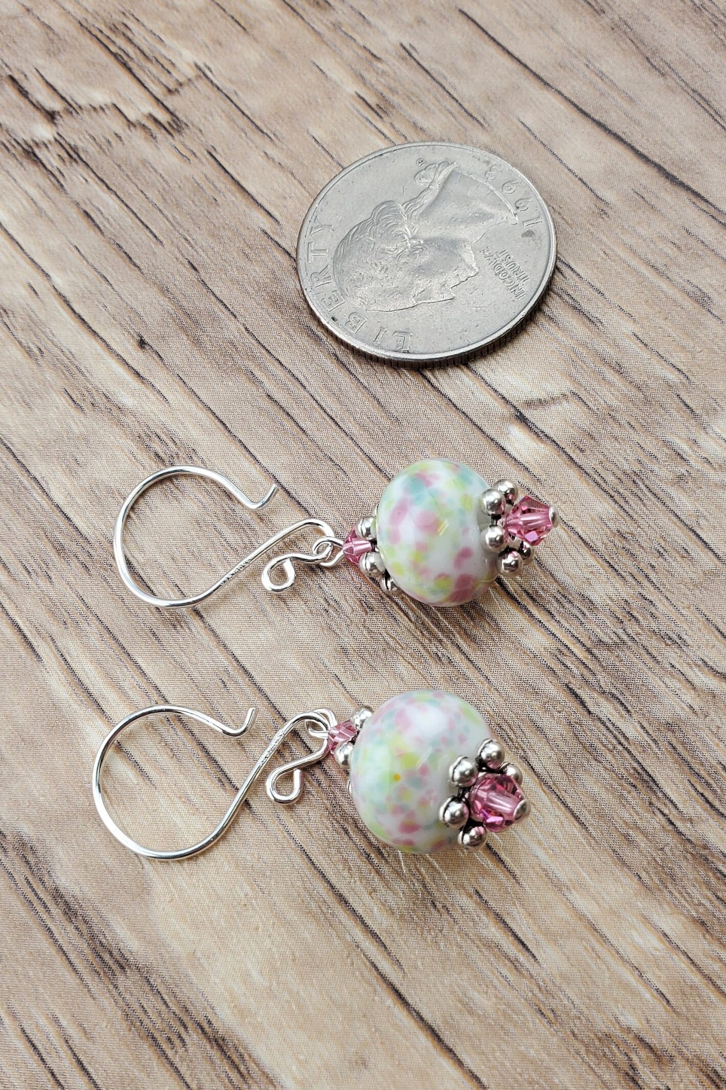 Robins egg Artisan Glass Earrings, Lampwork Glass Bead handcrafted by a talented artisan, Silver Filled Earring Wire. Lampwork beads filled with pink, green and yellow speckles complimented by pink crystal beads.