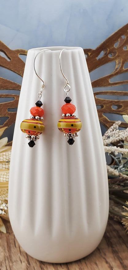 Siesta Time Artisan Glass Earrings, Lampwork Glass Bead by Grace Lampwork Beads, Sterling Silver Earring Wire. Orange, Yellow and Black colors make these earrings fun.