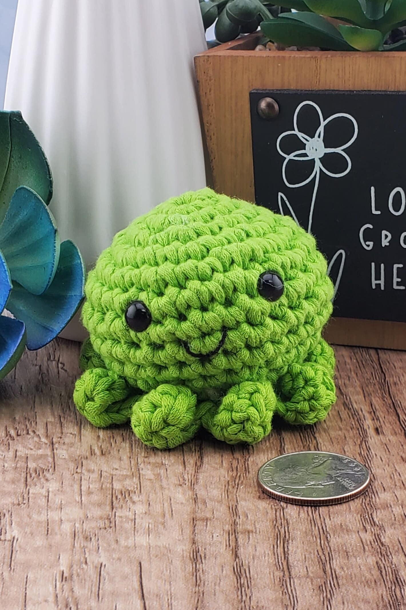 Handcrafted crocheted green Octopus buddy named Oscar.