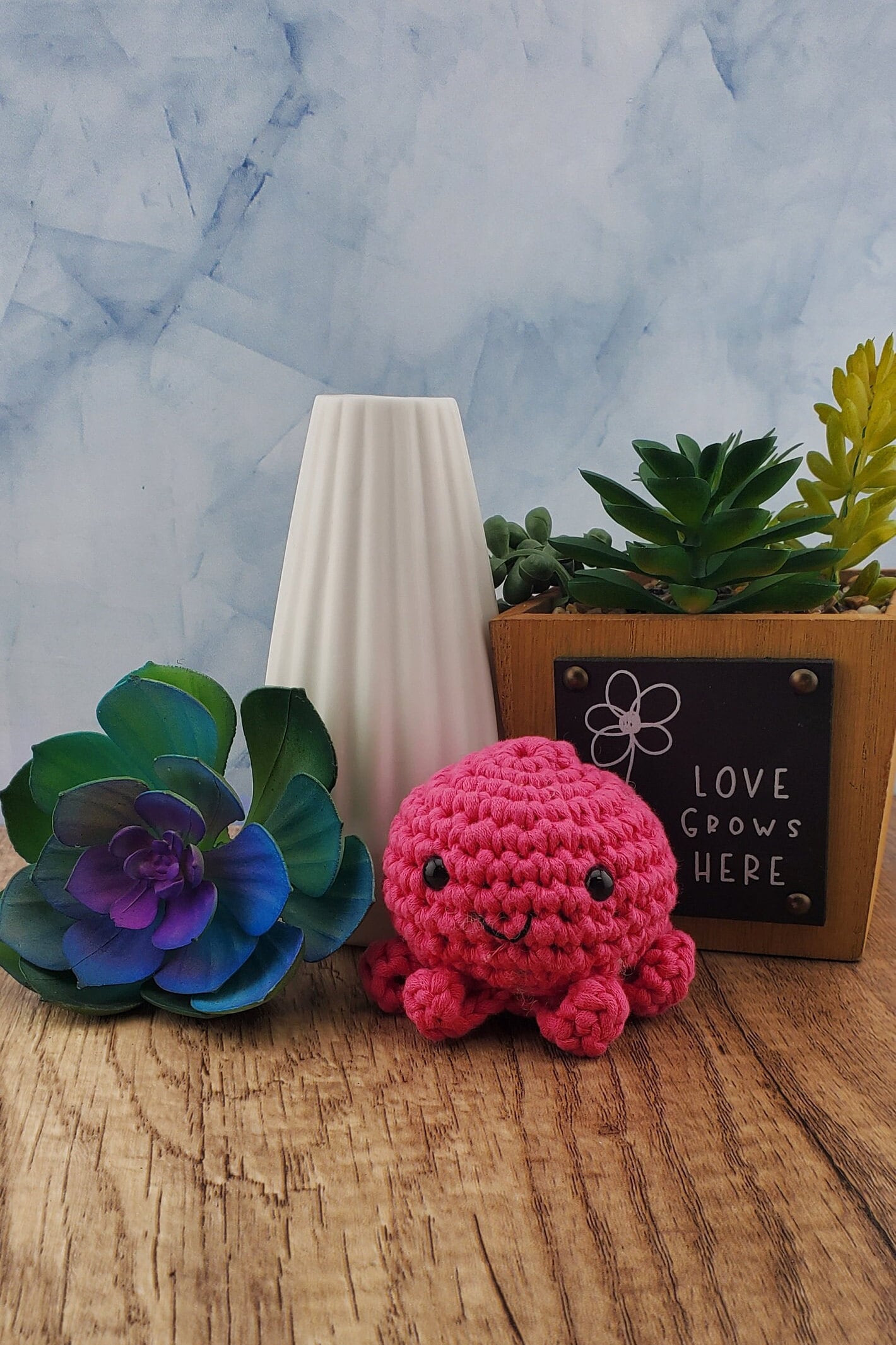 Handcrafted crocheted pink Octopus buddy named Ophelia