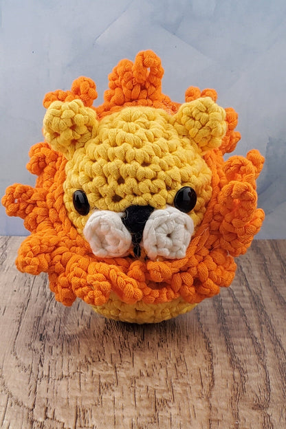 Handcrafted crocheted Lion buddy named Lionel. Yellow with an orange mane.