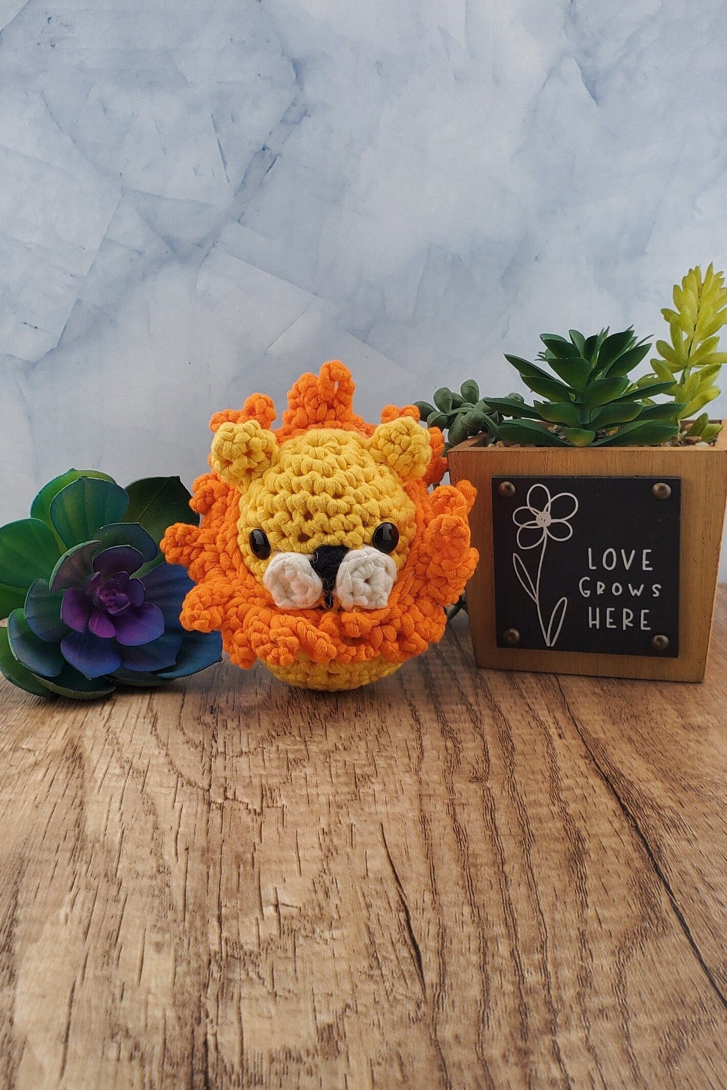 Handcrafted crocheted Lion buddy named Lionel. Yellow with an orange mane.