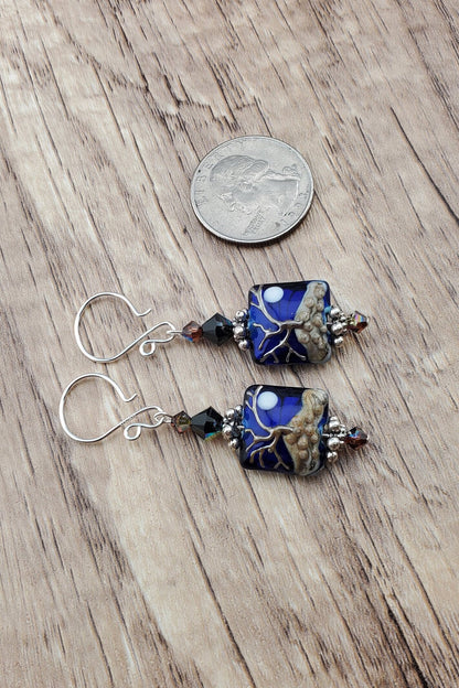 Cobalt Sky Earrings, Lamp work Glass Bead handcrafted by a talented artisan, Sterling Silver Earring Wire. Cobalt blue bead with copper tree in the foreground and a full moon.