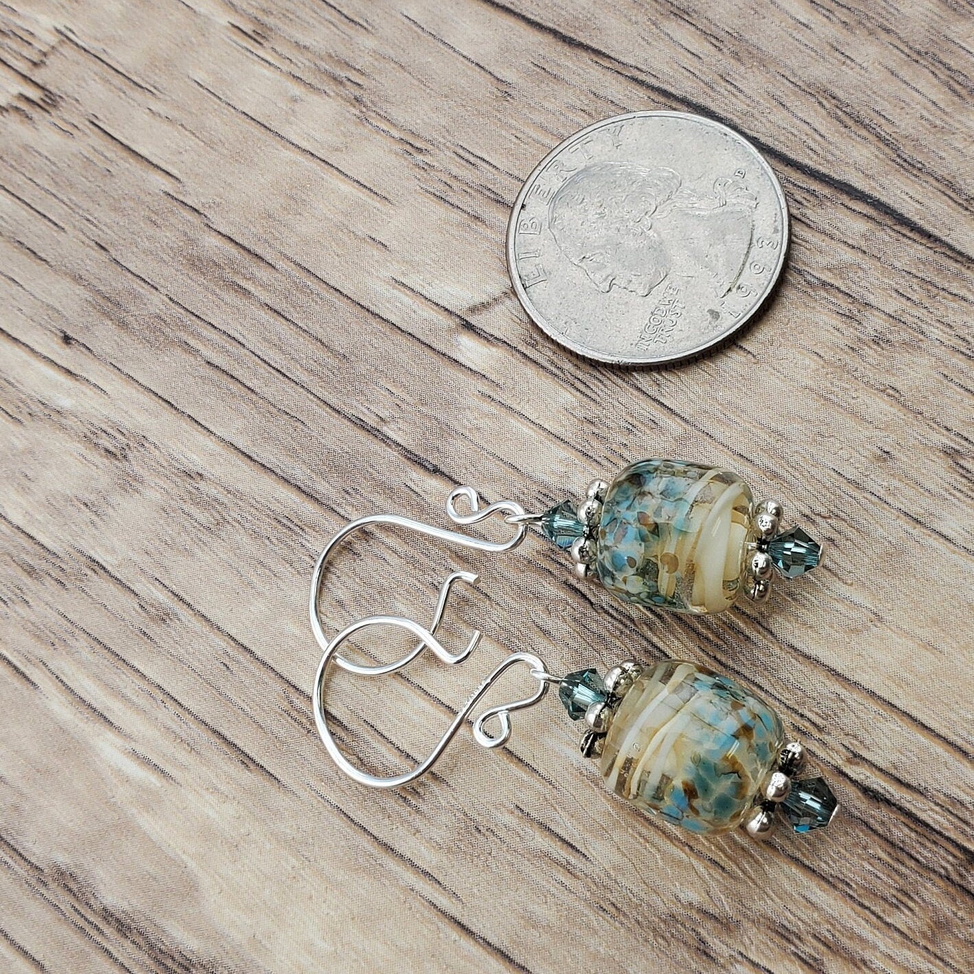 SF Sandy Shores Artisan Glass Earrings, Lampwork Glass Bead handcrafted by a talented artisan, Silver Filled Earring Wire. Soft blue green beads and a soft blue green along with cream color lampwork glass bead.