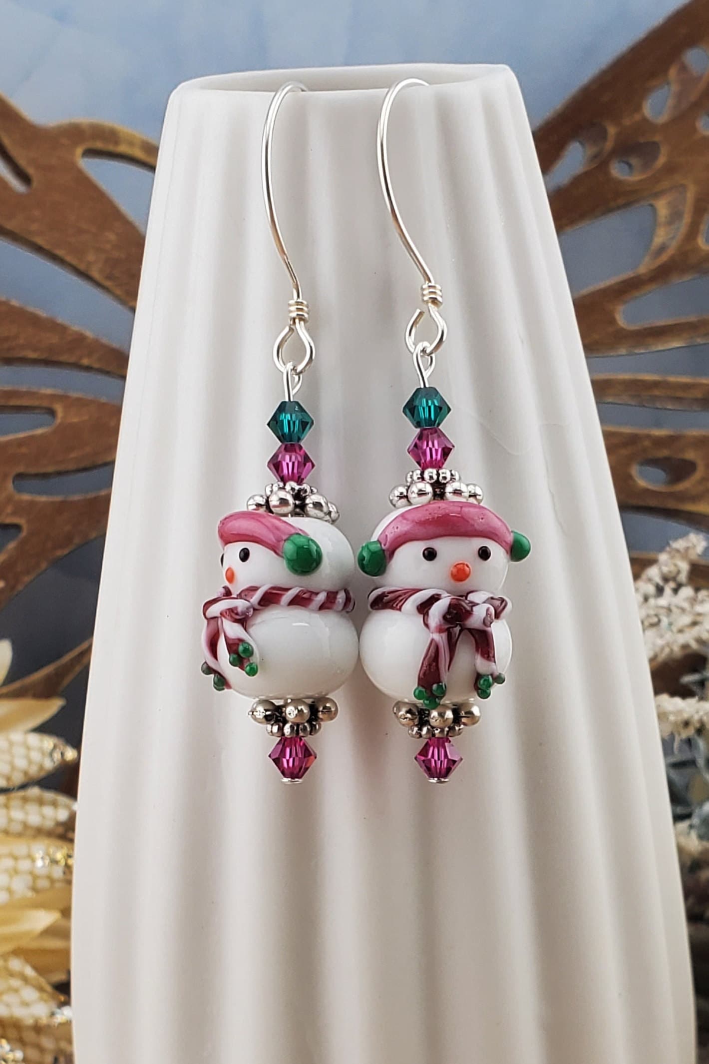 SS Blushing Snow Buddy Artisan Glass Earrings, Sterling Silver Earring Wire. Snowman with a pink scarf and green and pink crystal beads accenting the lampwork bead.