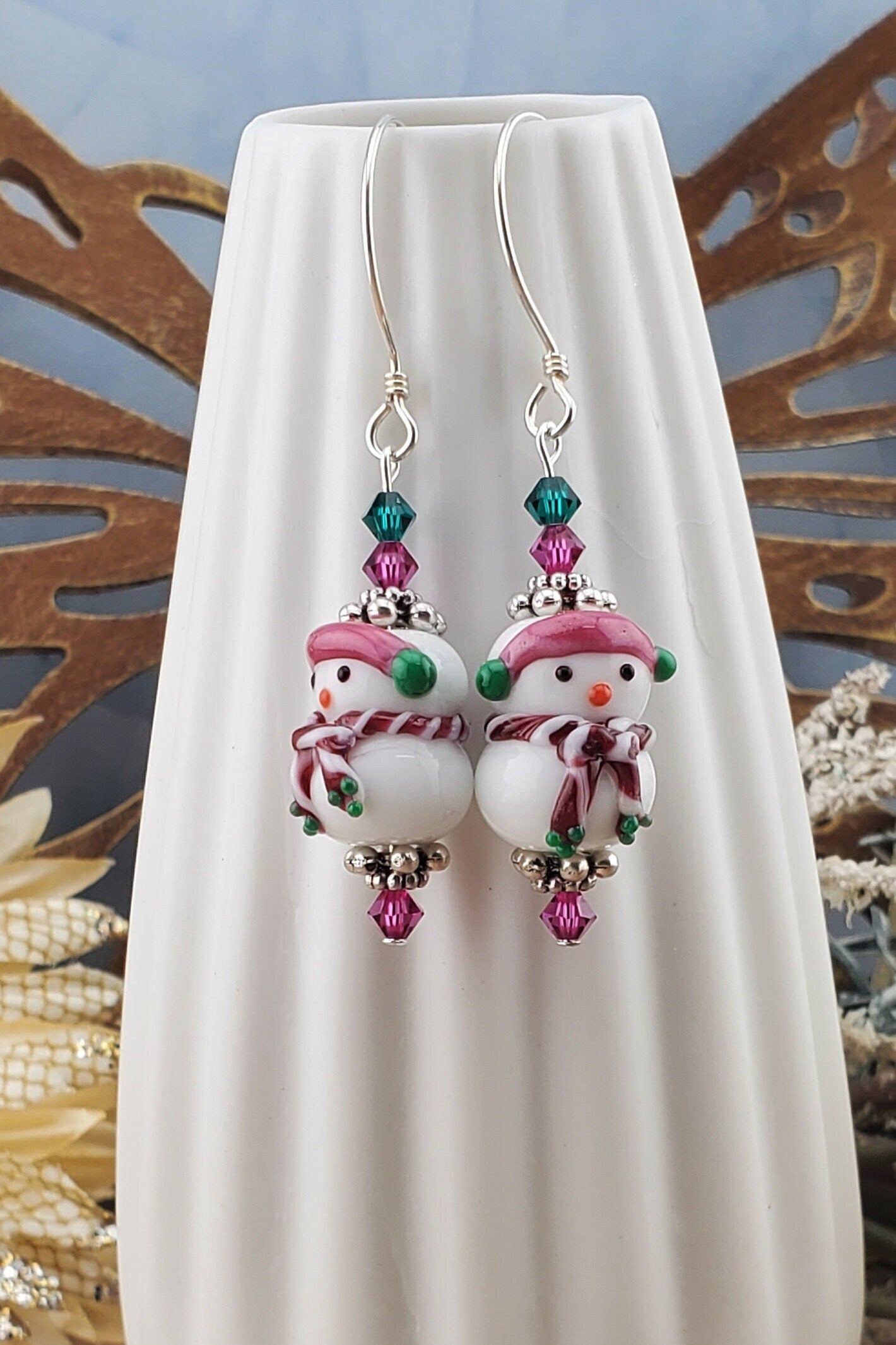 SS Blushing Snow Buddy Artisan Glass Earrings, Sterling Silver Earring Wire. Snowman with a pink scarf and green and pink crystal beads accenting the lampwork bead.