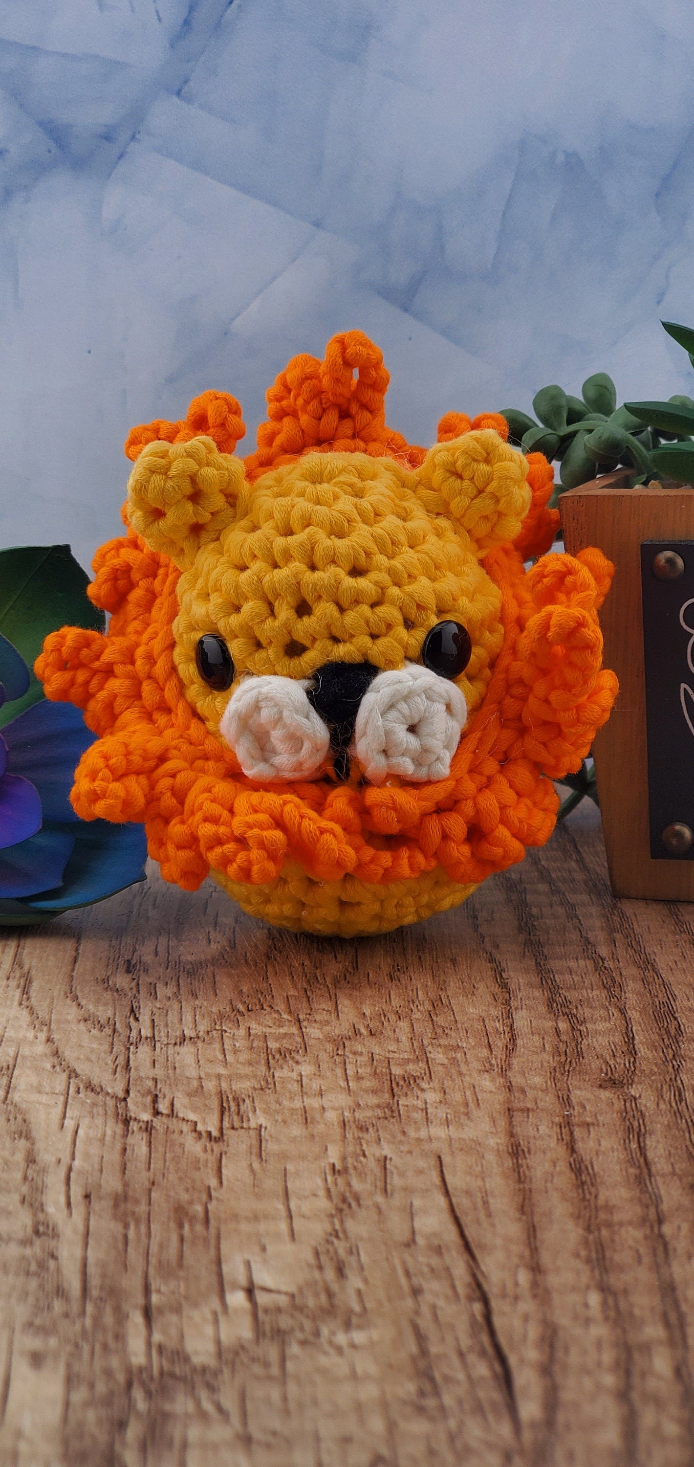 Handcrafted crocheted Lion buddy named Lionel. Yellow with an orange mane.