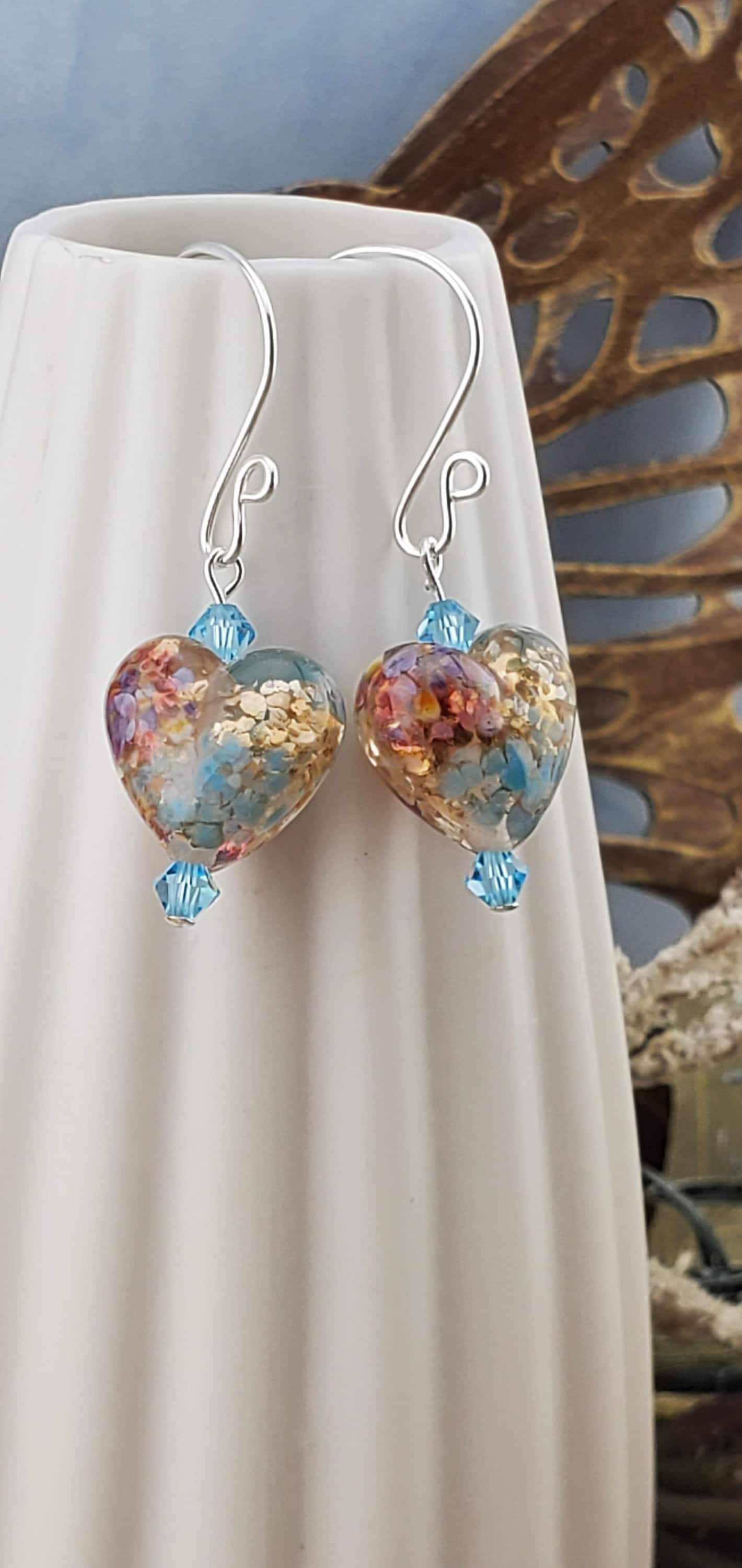 Fall in Love Artisan Glass Earrings, Lampwork Glass Bead handcrafted by a talented artisan, Silver Filled Earring Wire. Copper, blue and red swirls inside glass hearts accented with Blue crystal beads. Faill in love with autumn colors.