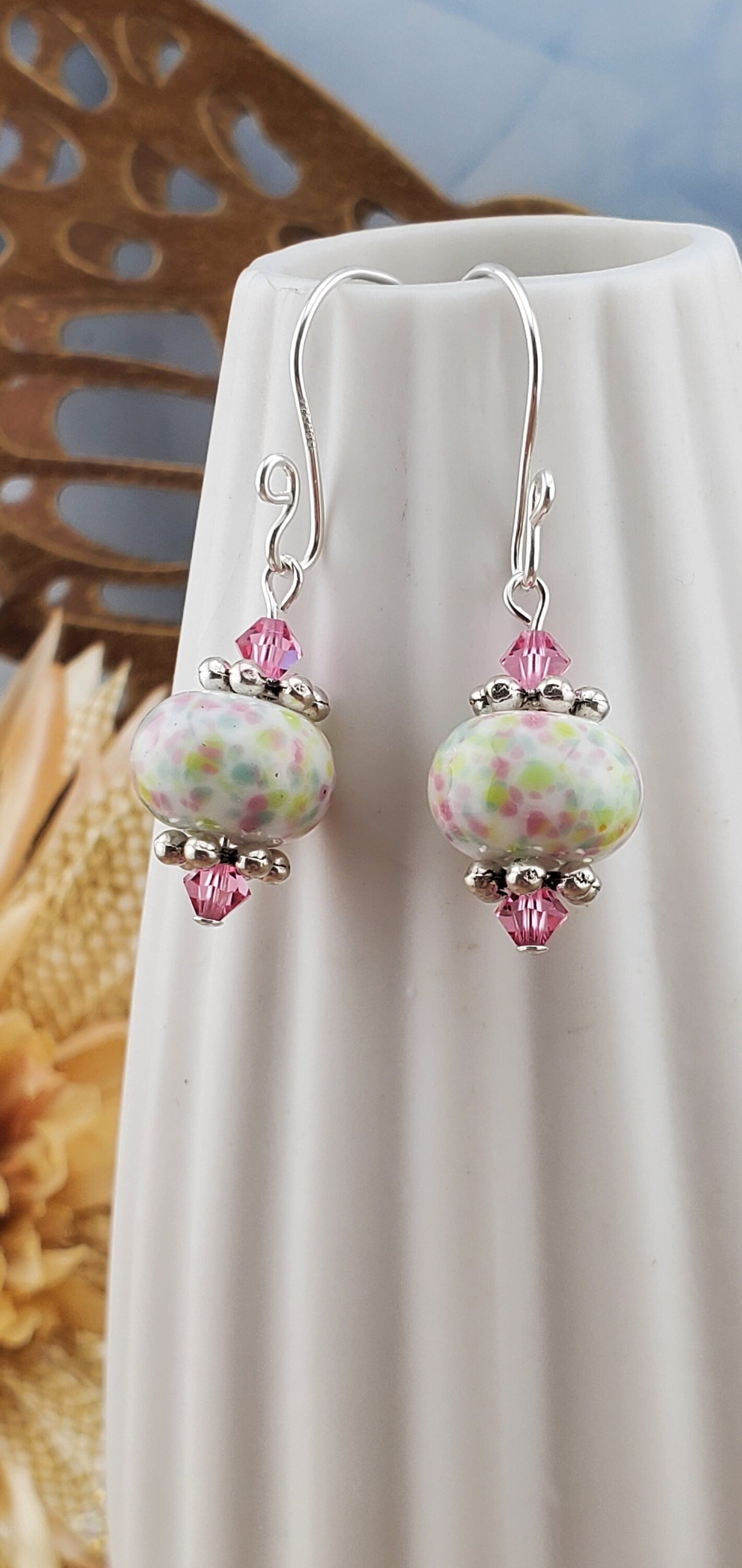 Robins egg Artisan Glass Earrings, Lampwork Glass Bead handcrafted by a talented artisan, Silver Filled Earring Wire. Lampwork beads filled with pink, green and yellow speckles complimented by pink crystal beads.