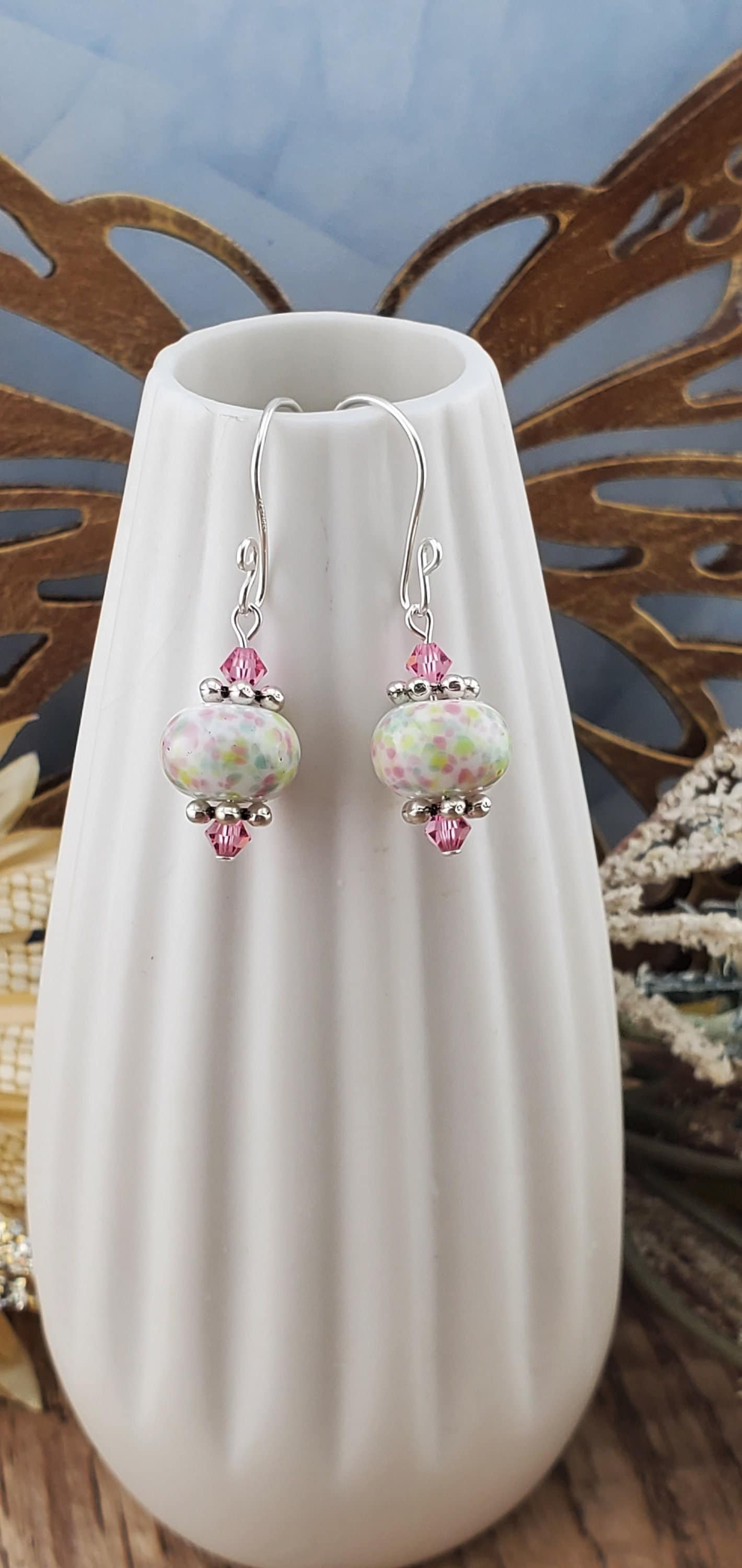 Robins egg Artisan Glass Earrings, Lampwork Glass Bead handcrafted by a talented artisan, Silver Filled Earring Wire. Lampwork beads filled with pink, green and yellow speckles complimented by pink crystal beads.