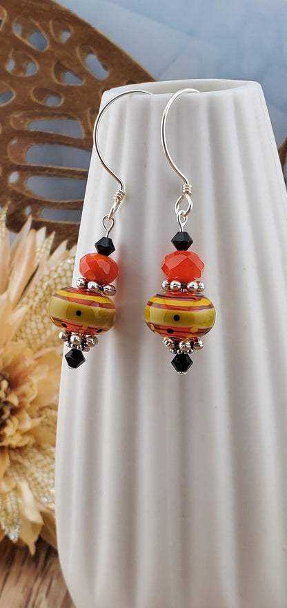 Siesta Time Artisan Glass Earrings, Lampwork Glass Bead by Grace Lampwork Beads, Sterling Silver Earring Wire. Orange, Yellow and Black colors make these earrings fun.