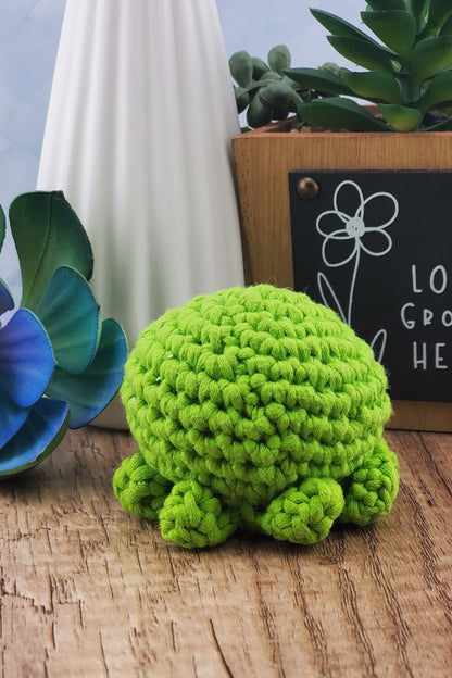 Handcrafted crocheted green Octopus buddy named Oscar.