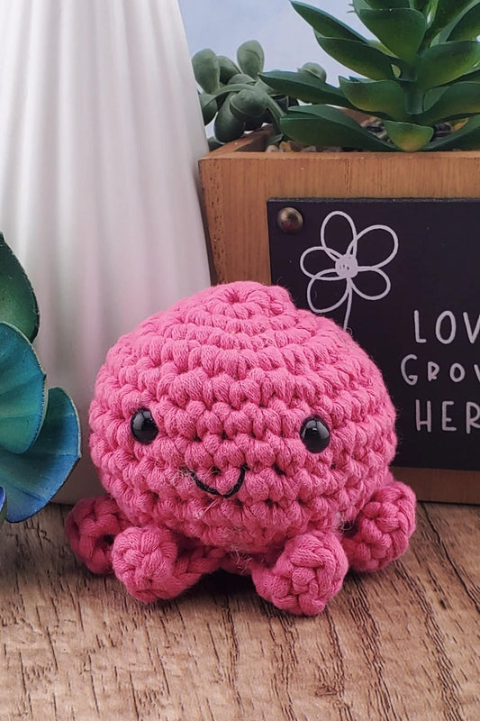 Handcrafted crocheted pink Octopus buddy named Ophelia