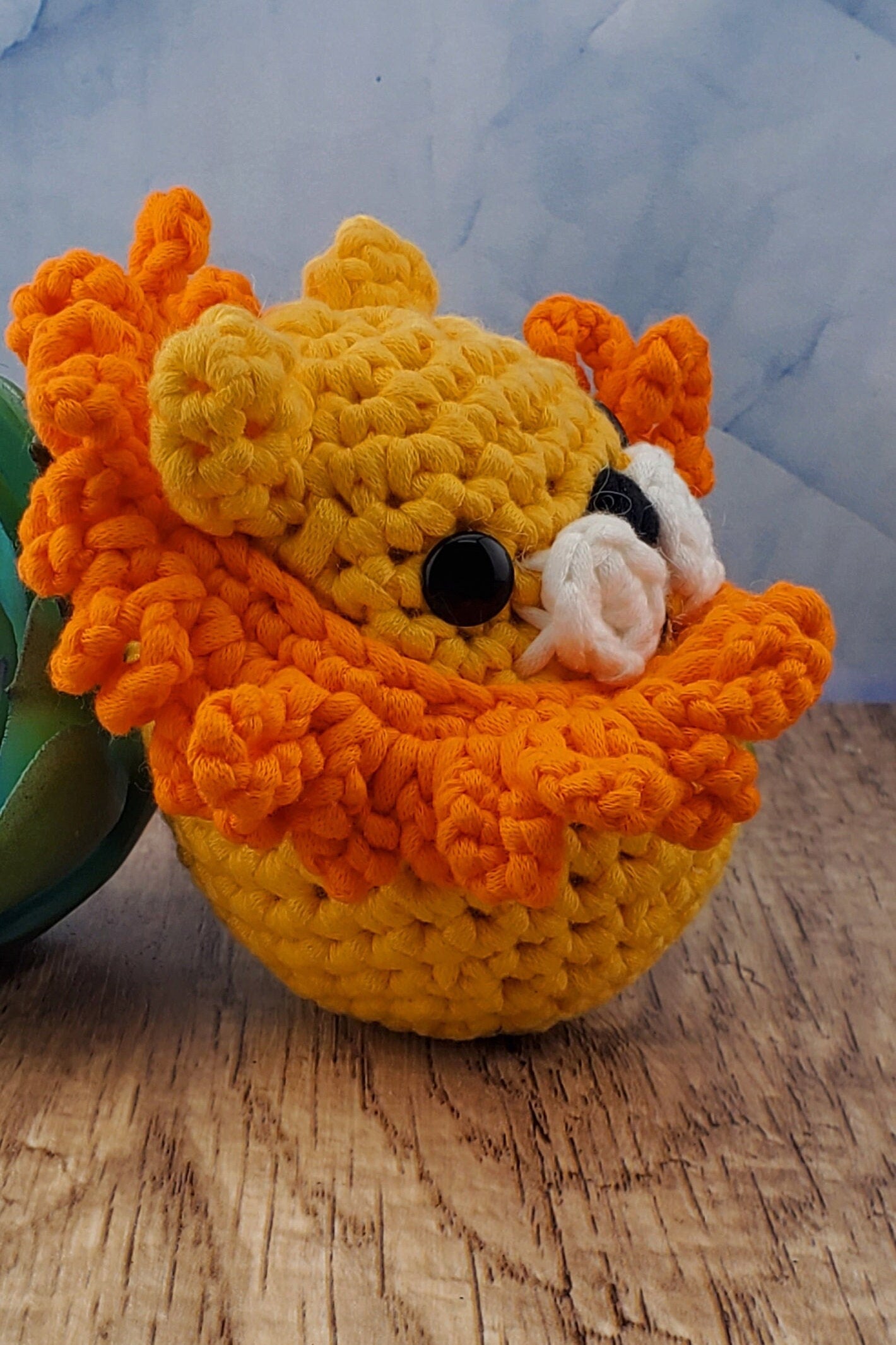 Handcrafted crocheted Lion buddy named Lionel. Yellow with an orange mane.