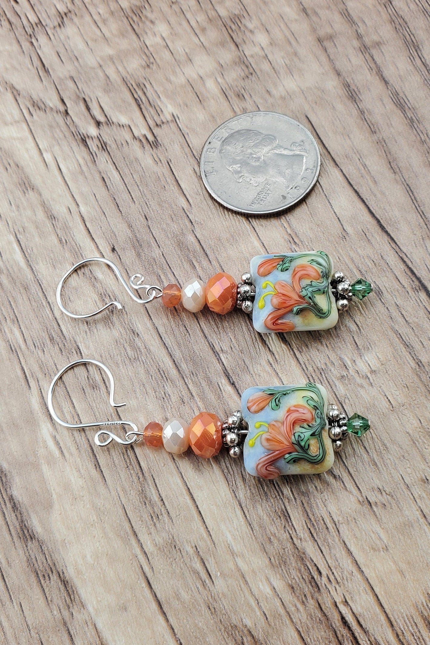 Floral Bliss Artisan Glass Earrings, Lampwork Glass Bead by Grace Lampwork Beads, Sterling Silver Earring Wire. Orange, peach and green floral colors.