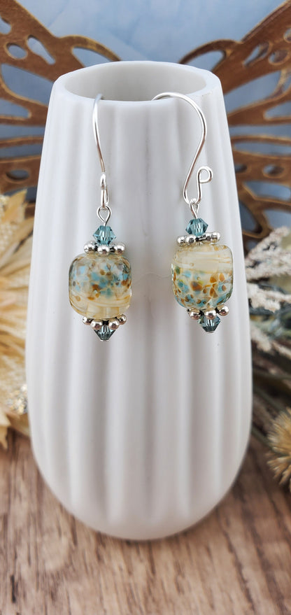 SF Sandy Shores Artisan Glass Earrings, Lampwork Glass Bead handcrafted by a talented artisan, Silver Filled Earring Wire. Soft blue green beads and a soft blue green along with cream color lampwork glass bead.