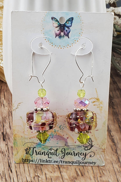 SF Springtime Whispers Artisan Glass Earrings, Lampwork Glass Bead handcrafted by a talented artisan, Silver Filled Earring Wire. Pink and Green swirls with golden accents make this lampwork glass bead. It is accented with pink and green crystals.