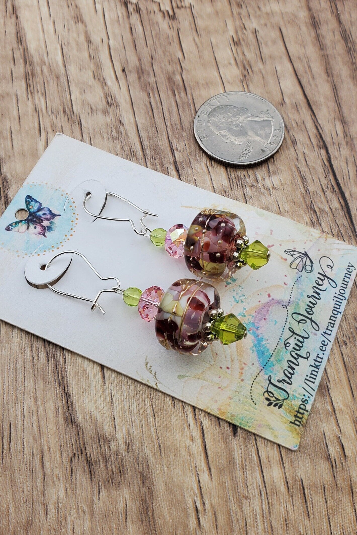 SF Springtime Whispers Artisan Glass Earrings, Lampwork Glass Bead handcrafted by a talented artisan, Silver Filled Earring Wire. Pink and Green swirls with golden accents make this lampwork glass bead. It is accented with pink and green crystals.