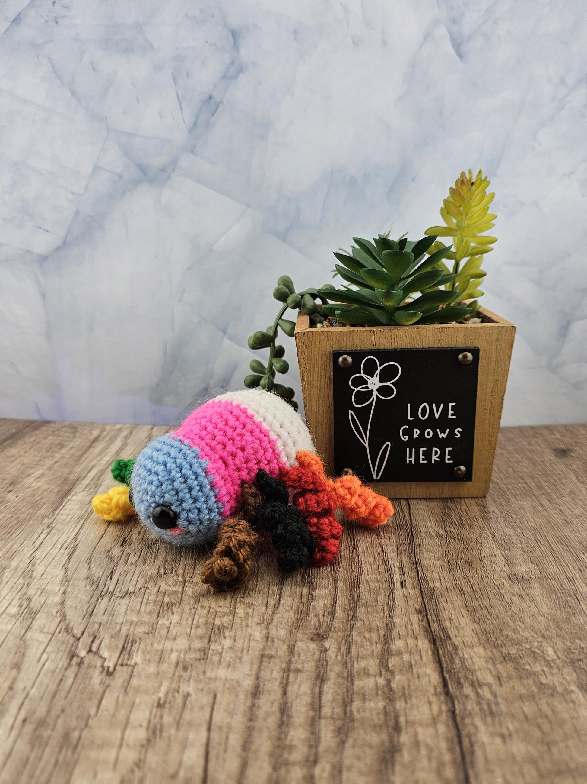 Handcrafted crocheted pride flag Spider buddy named Justice
