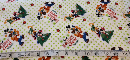Mickey & Friends Trim the Christmas Tree Disney Fabric by the half yard. 100% Cotton.
