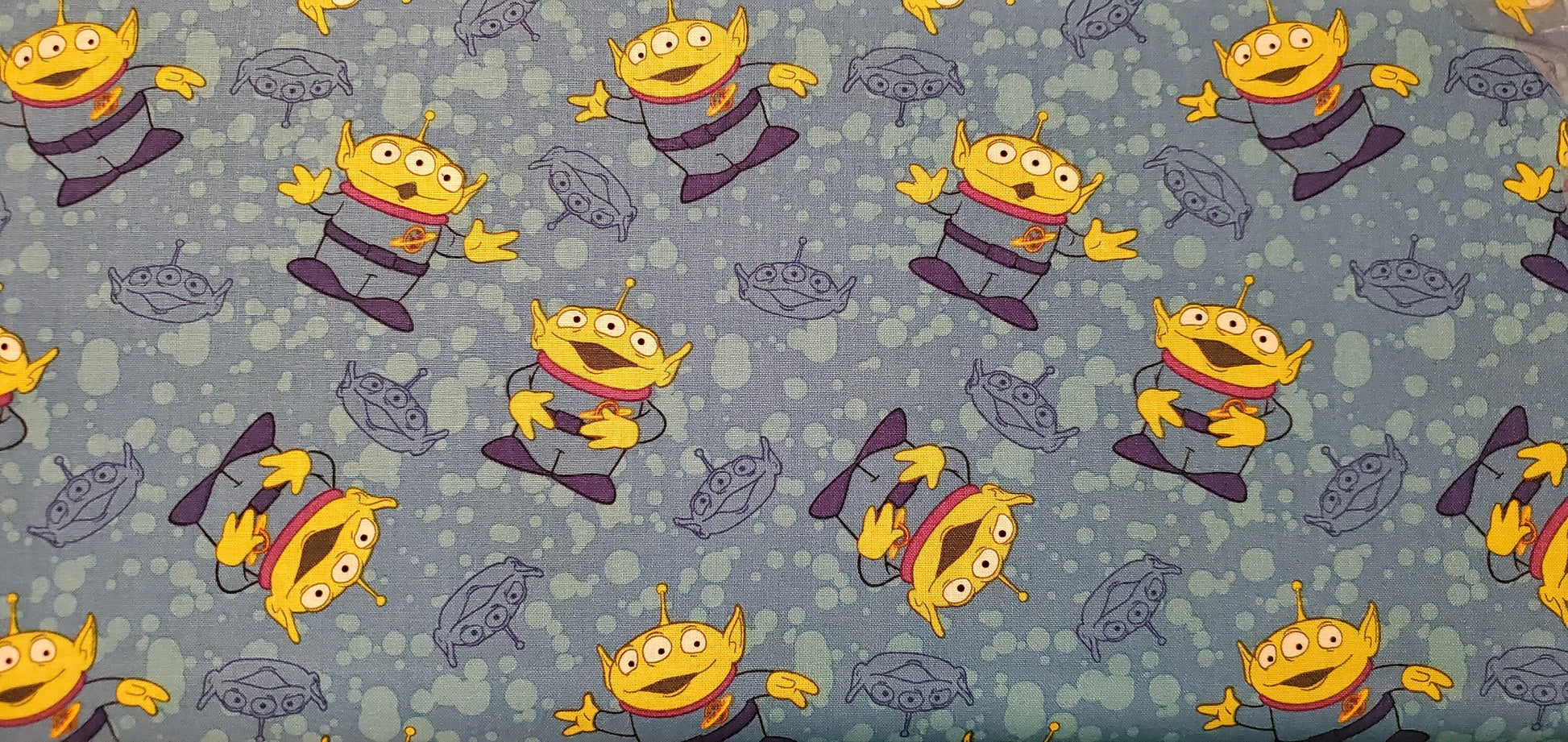 Disney Alien Toss TOY STORY Fabric by the half yard. 100% Cotton.