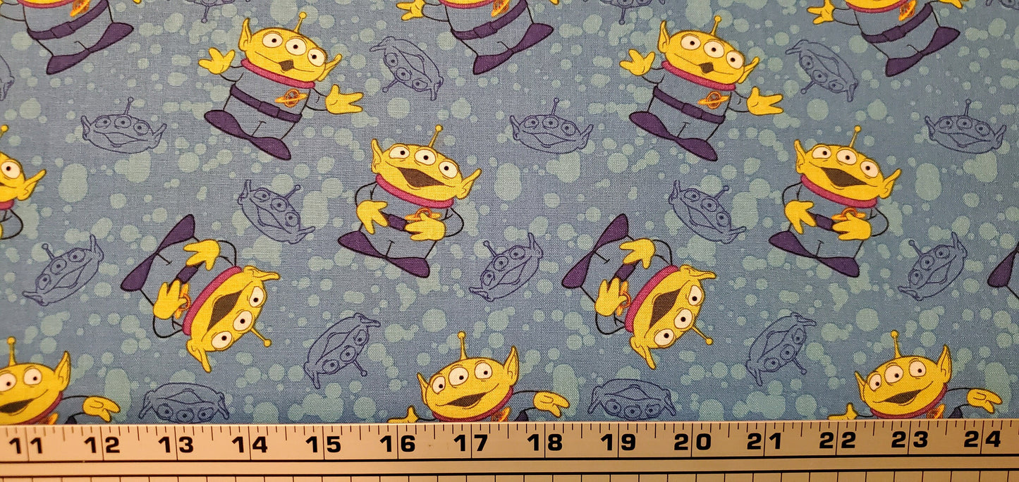 Disney Alien Toss TOY STORY Fabric by the half yard. 100% Cotton.