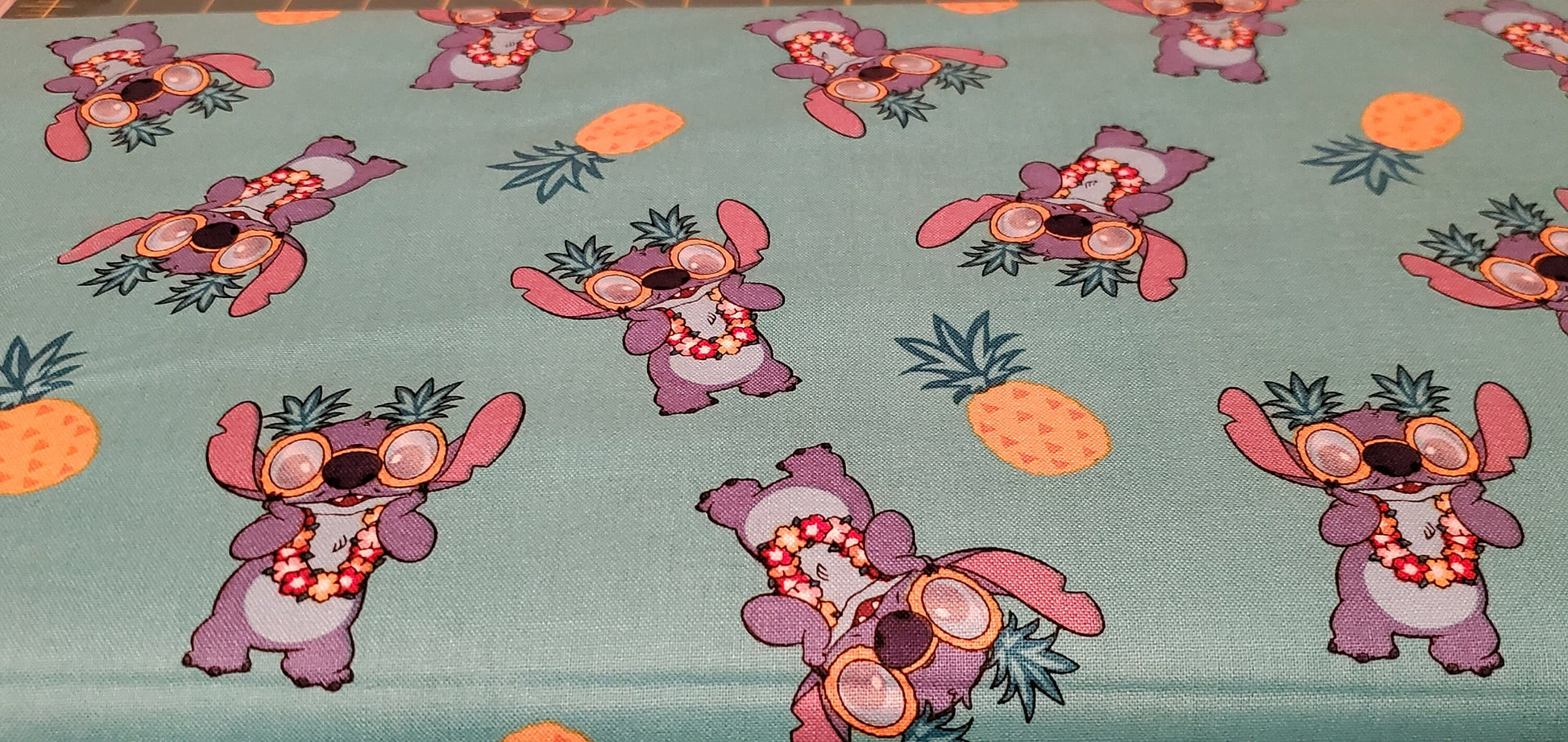 Disney Stitch Pineapple Fabric by the half yard. 100% Cotton.