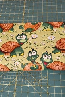 Goofy Turtles Fabric by the half yard. 100% Cotton.