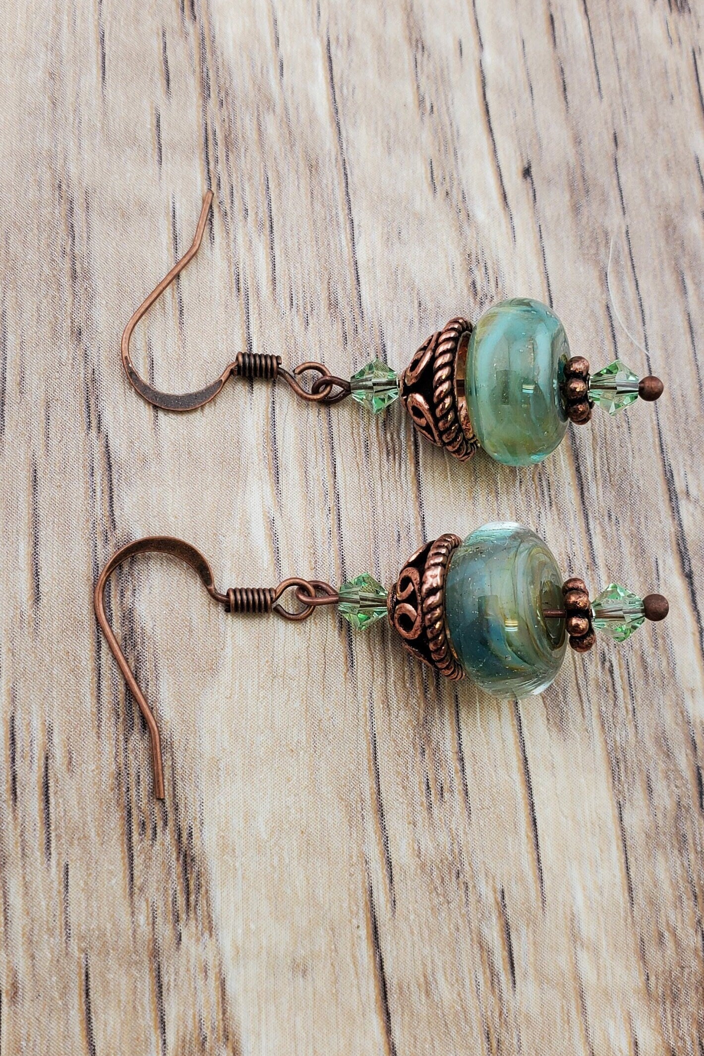 Spiritual Oasis Glass Earrings, Lampwork Glass Bead handcrafted by a talented artisan, Copper Earring Wire