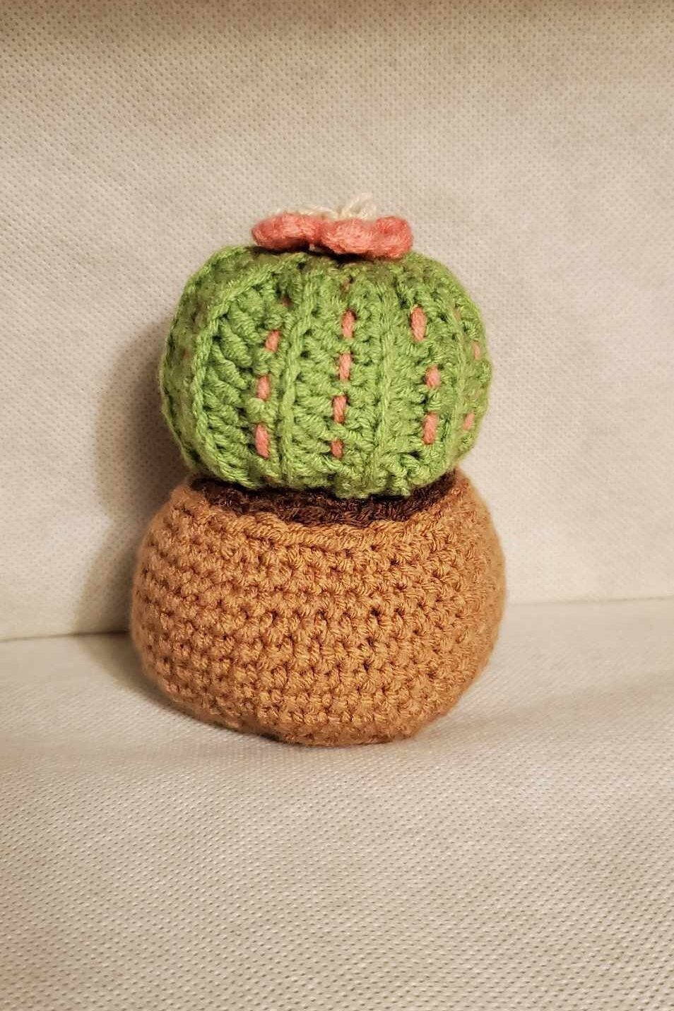 Cute handmade crochet cactus in a pot.