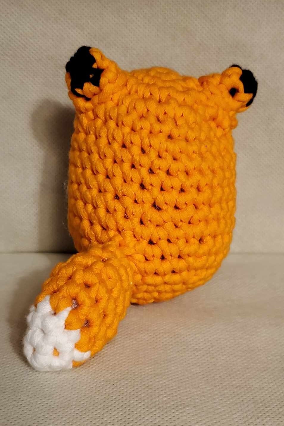 Handcrafted crocheted fox buddy named Copper. Orange and White with black tipped ears.