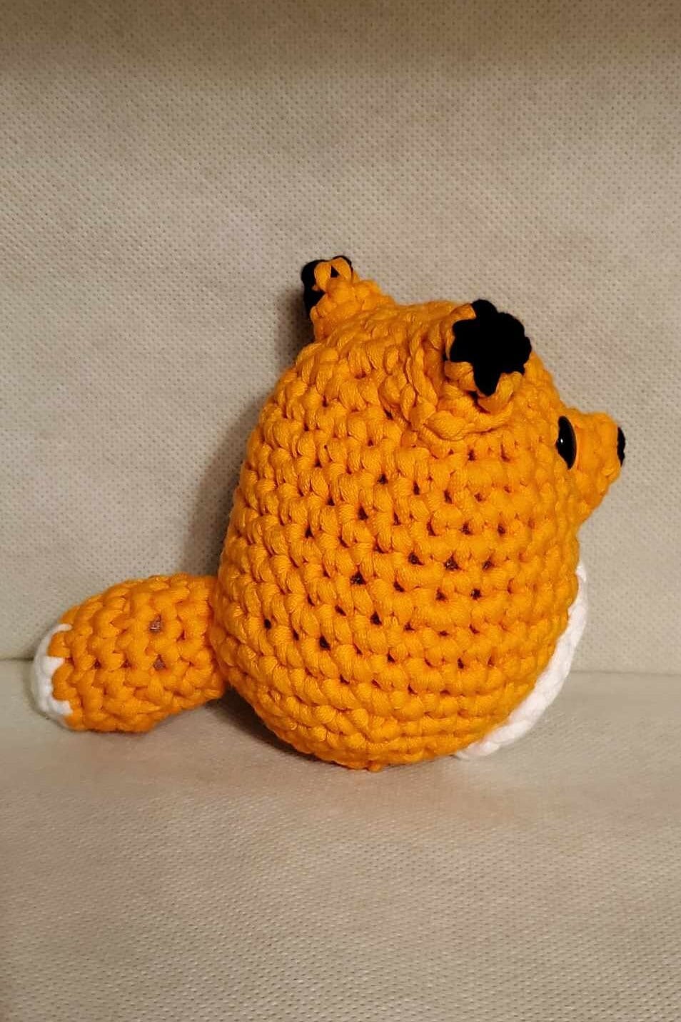 Handcrafted crocheted fox buddy named Copper. Orange and White with black tipped ears.