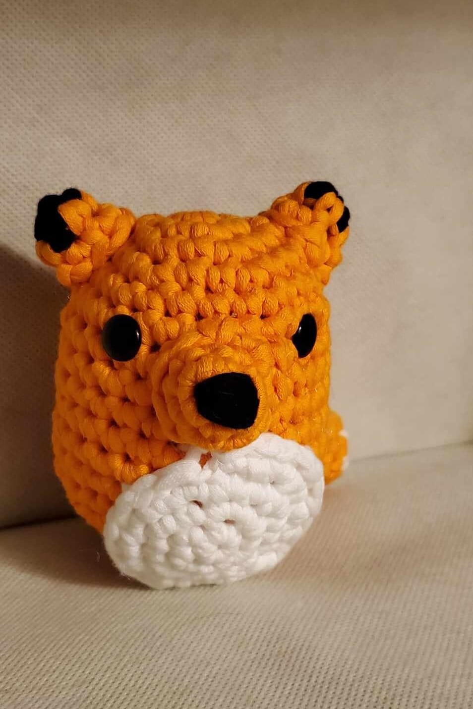 Handcrafted crocheted fox buddy named Copper. Orange and White with black tipped ears.
