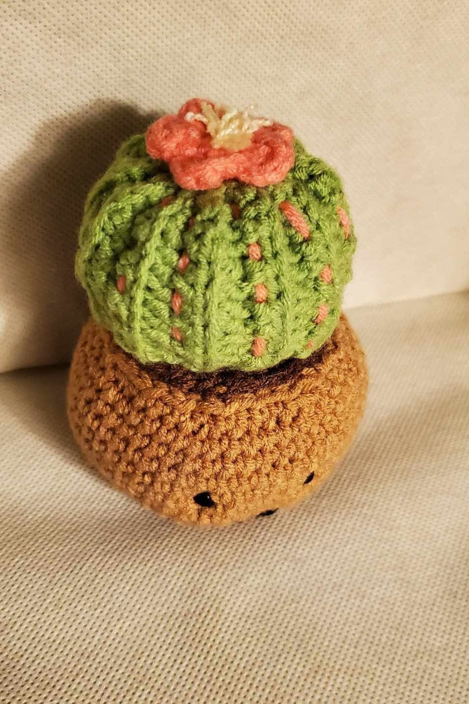 Cute handmade crochet cactus in a pot.