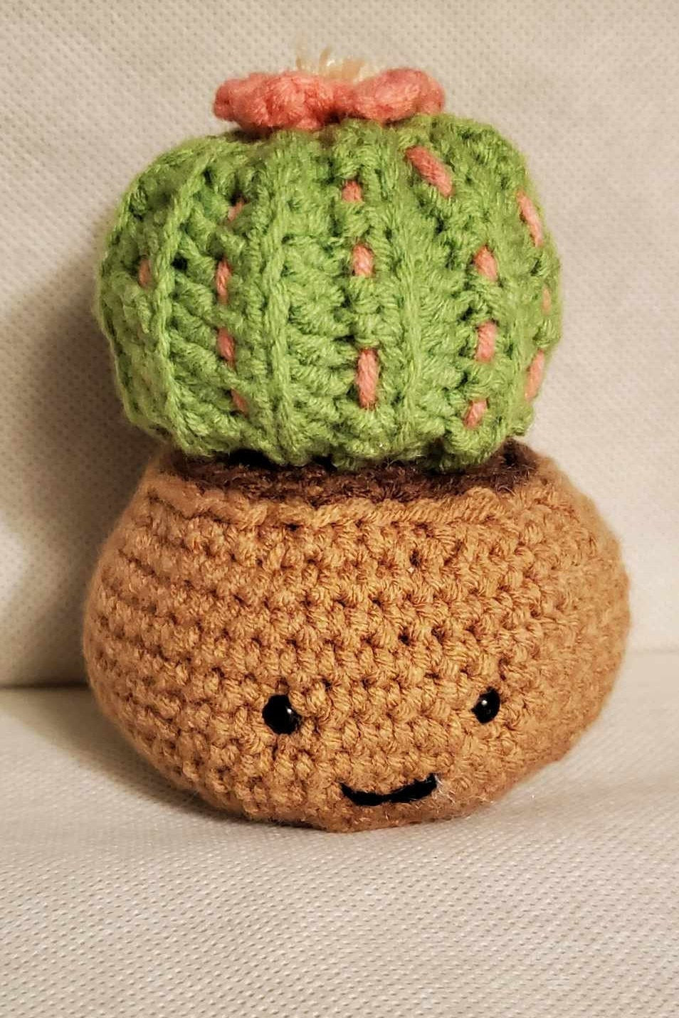 Cute handmade crochet cactus in a pot.